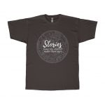 A black T-shirt decorated with a constellation star chart and the words "Stories tame the stars and make them ours."