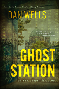 A view of Berlin with an elaborate building and graffiti. Everything is overlaid with letter pairs from an encryption. The cover for Ghost Station by Dan Wells.